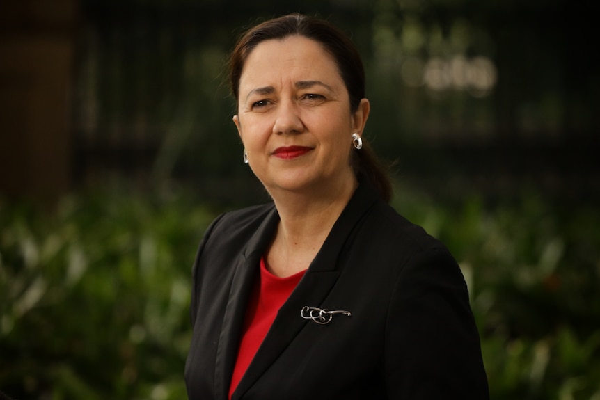 Annastacia Palaszczuk looks thoughtful as as she listens at a media conference.