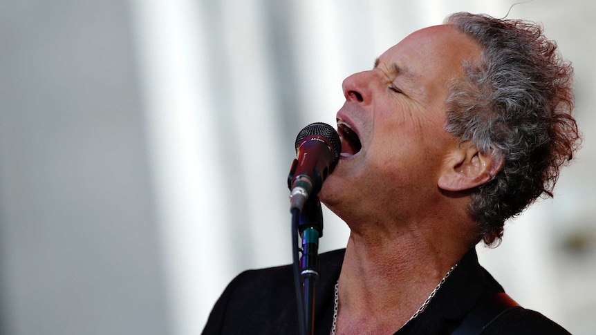 Lindsey Buckingham singing passionately.