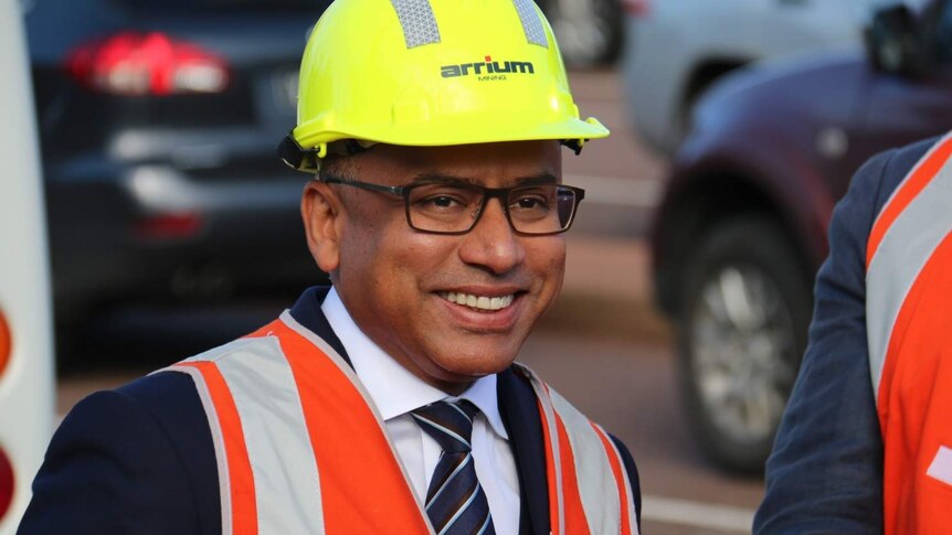 Smiling Sanjeev Gupta in a hard hat and safety vest.