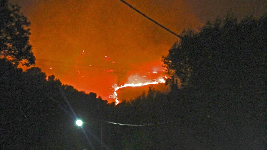 A grass fire near Mitcham in the Adelaide foothills lit up the night sky