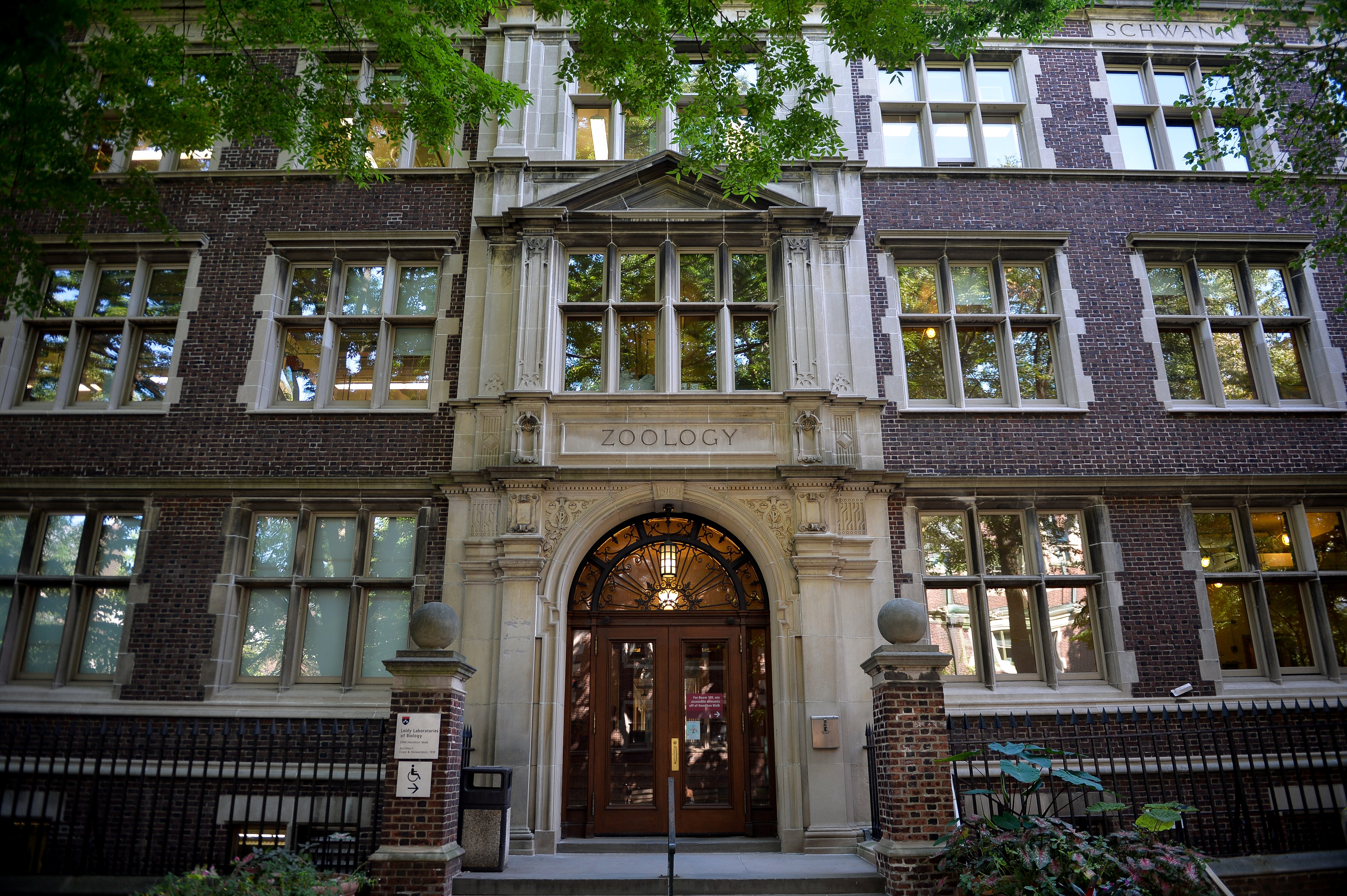 The entrance to a large, old stone building with lots of windows