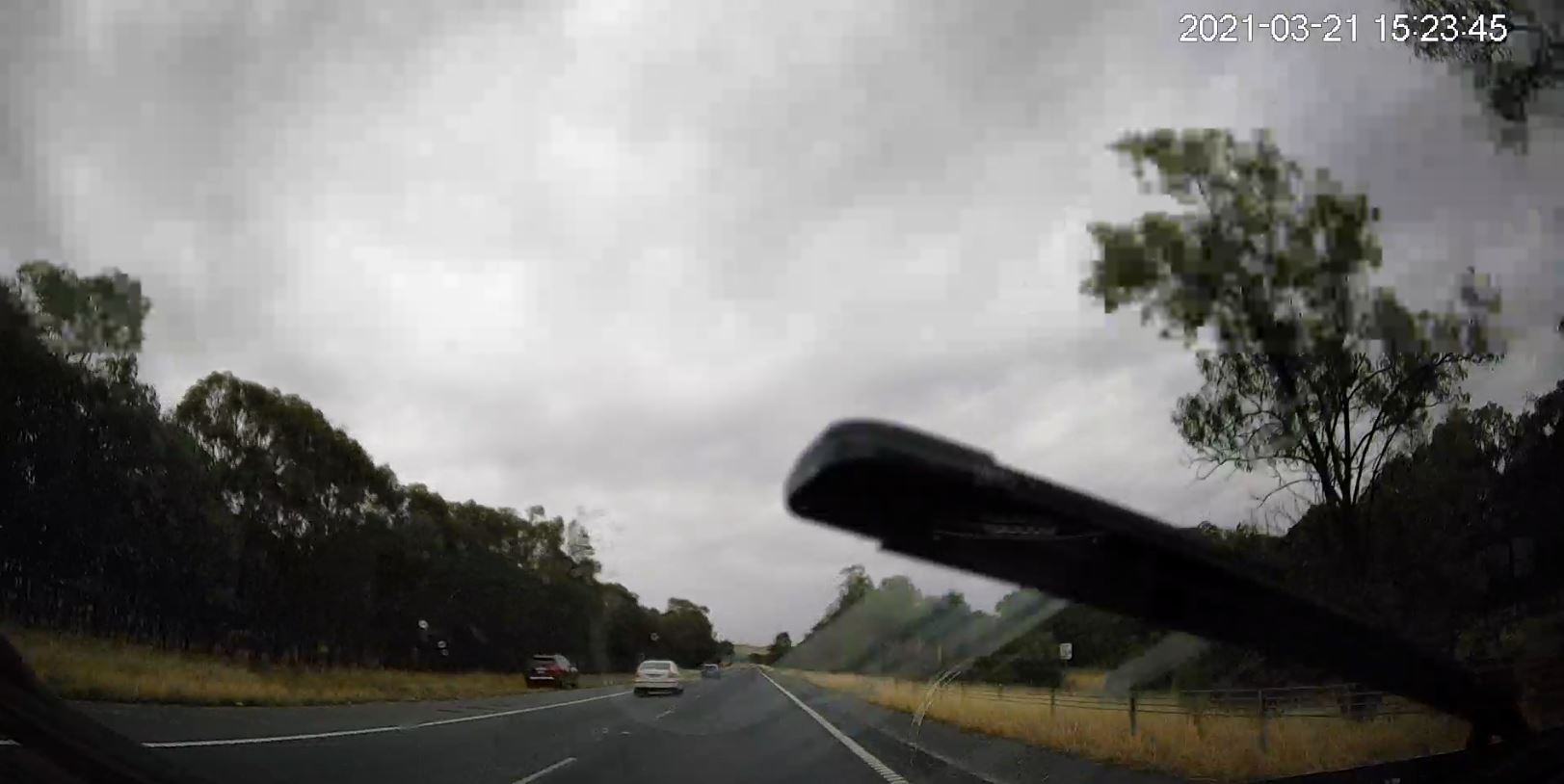 photo from car dash with mobile speed camera on the left side if road