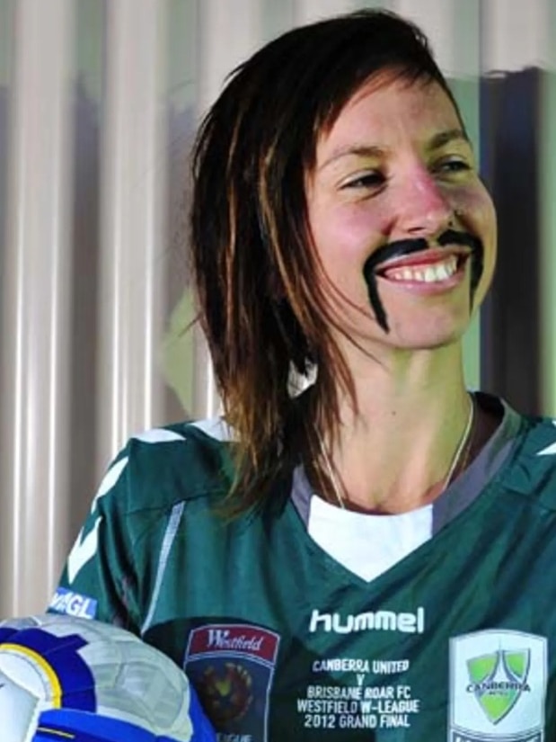 Sally Shipard of Canberra United smiles while sporting a black moustache during a Movember fundraising campaign