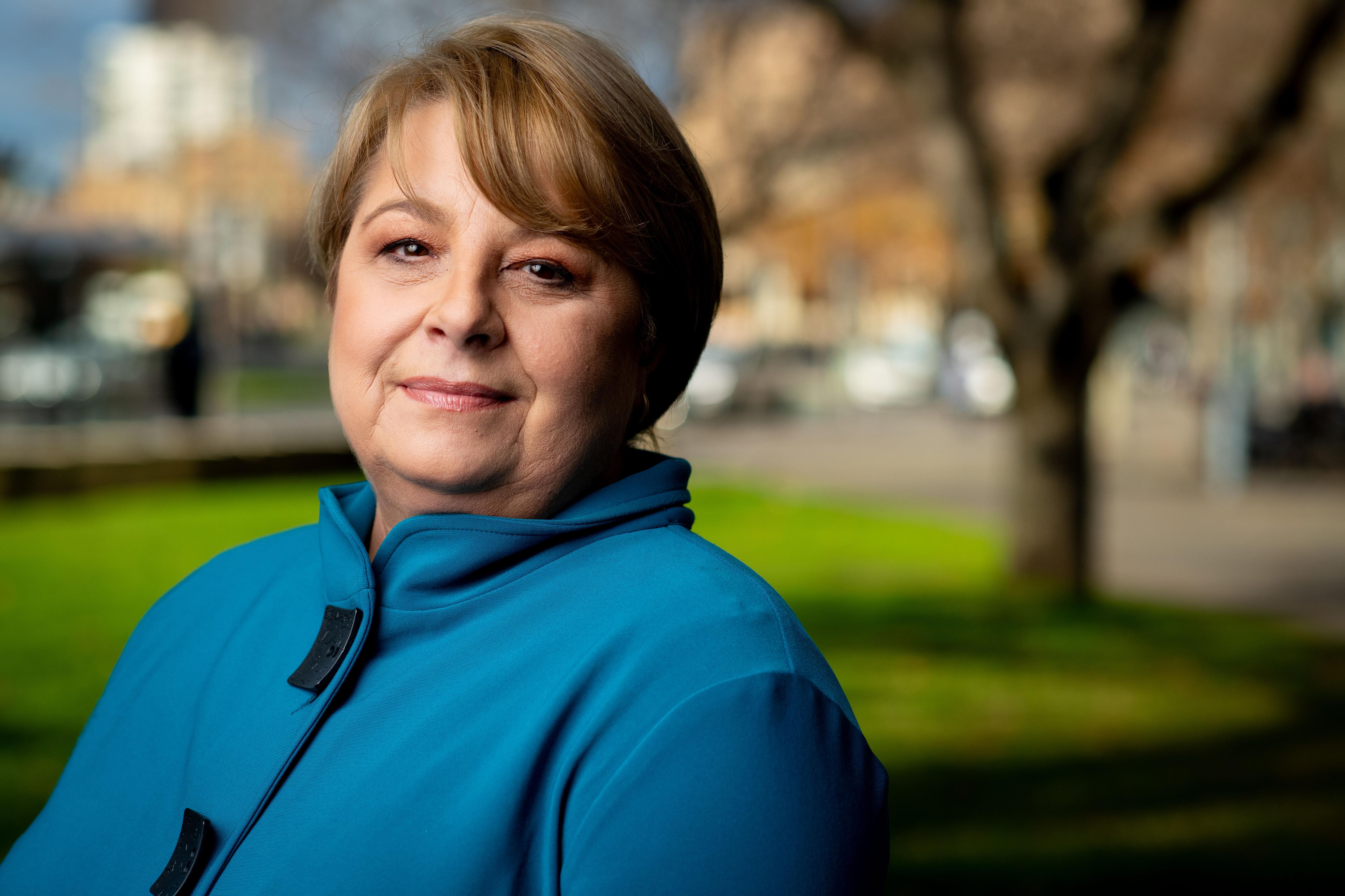 A woman in a blue top in Adelaide's CBD.