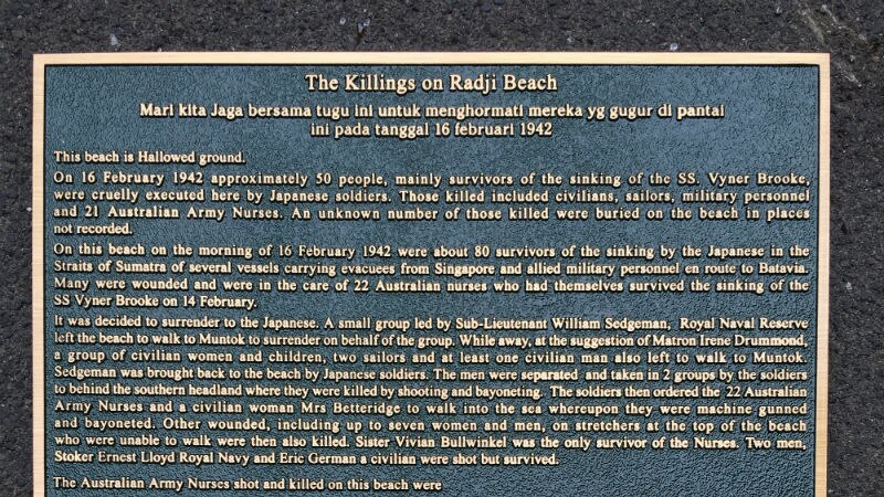 A plaque on Radji Beach.