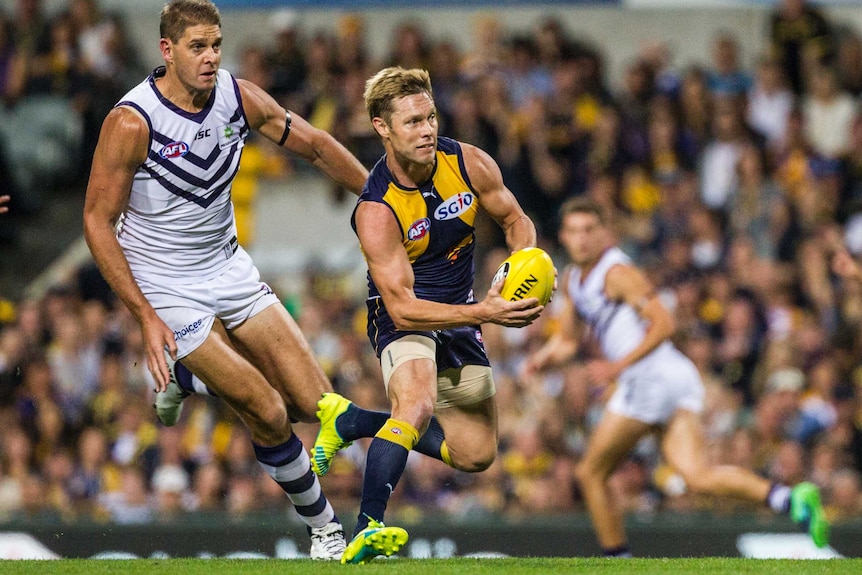 Fremantle's Aaron Sandilands (L) and West Coast's Sam Mitchell (R) at Subiaco Oval.