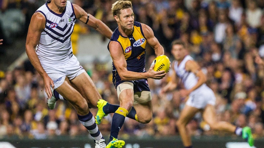 Fremantle's Aaron Sandilands (L) and West Coast's Sam Mitchell (R) at Subiaco Oval.