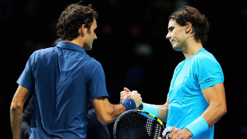 Roger Federer congratulates Spain's Rafael Nadal after Nadal's win at the World Tour Finals.