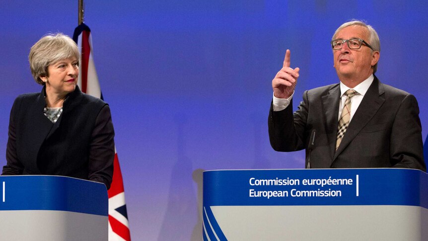 British Prime Minister Theresa May, left, stands next to European Commission President Jean-Claude Juncker