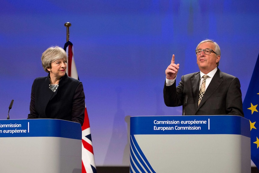 British Prime Minister Theresa May, left, stands next to European Commission President Jean-Claude Juncker