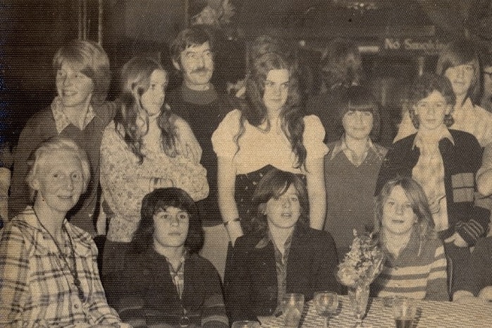 David Cook as a child, standing in a group smiling.