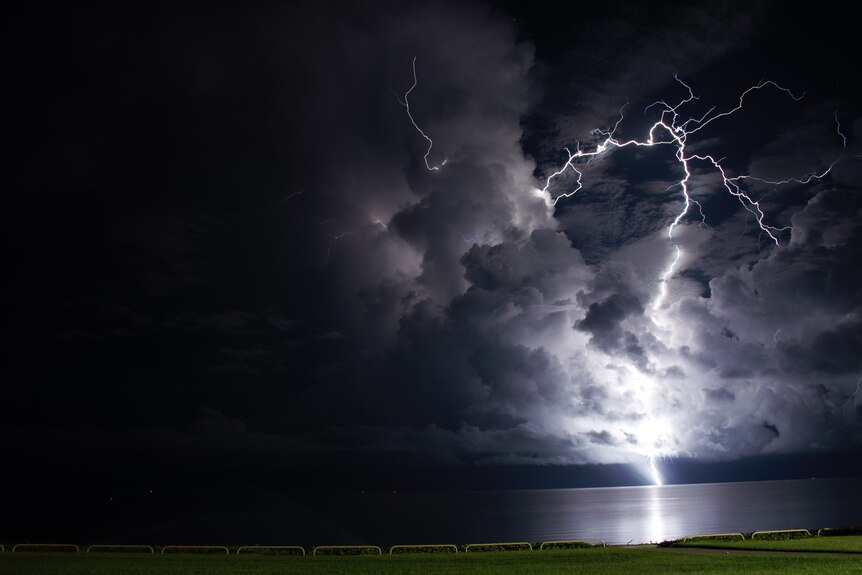 A lightning bolt against a night sky. 