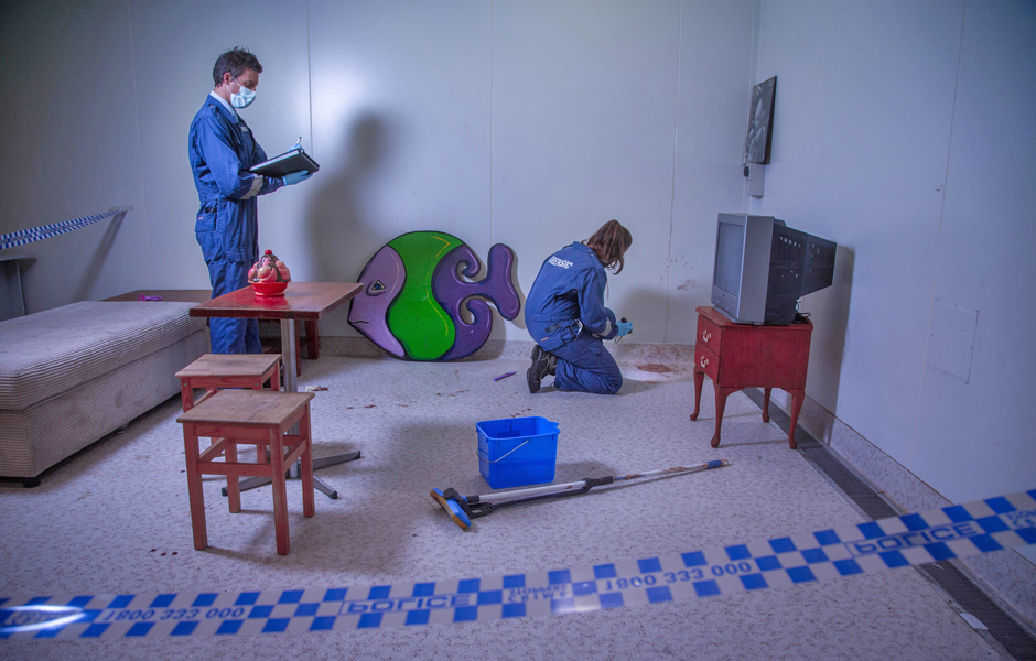 Bloodstain pattern analysts in a training scenario