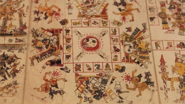 A piece of fabric or paper with Aztec pictorial glyphs