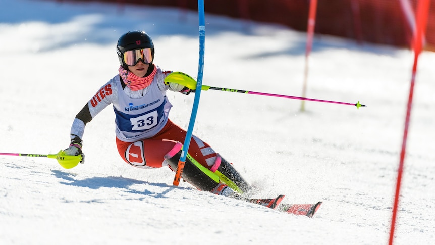 A female alpine skier competes in a slalom race in the United States.