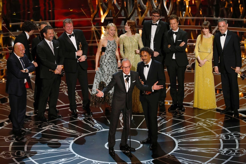 Michael Keaton and director Alejandro Inarritu accept an Oscar