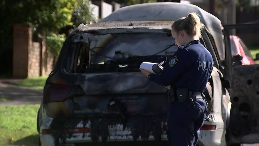 Police investigate three burnt-out cars near Revesby shooting scene