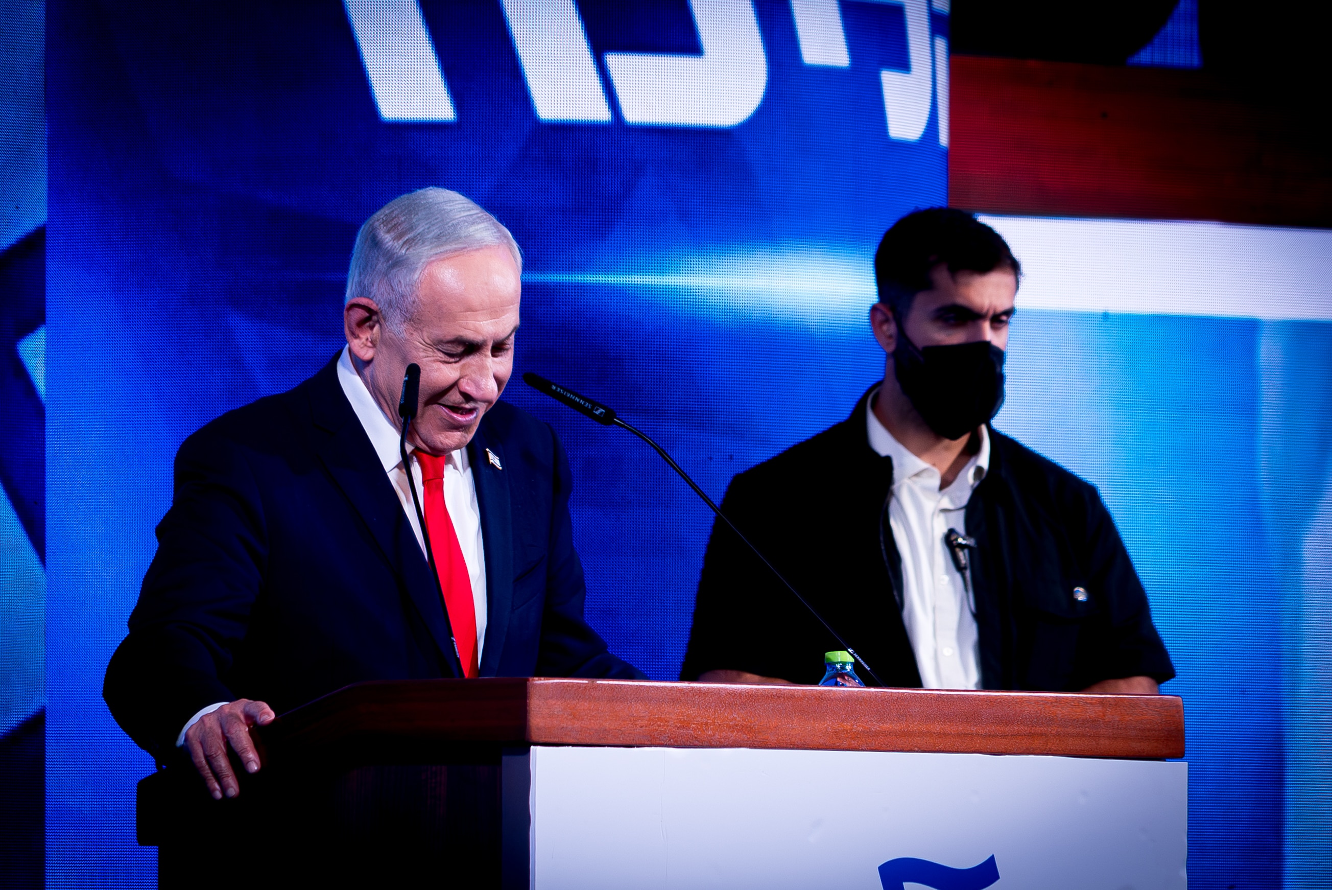 Netanyahu standing at a podium