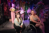 A group of performers on stage in a bar