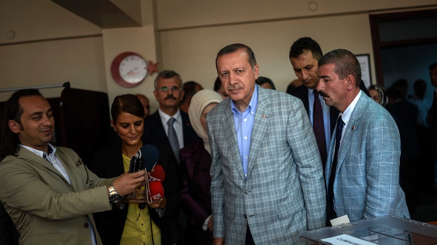 Turkish PM Recep Tayyip Erdogan casts his vote in the presidential election