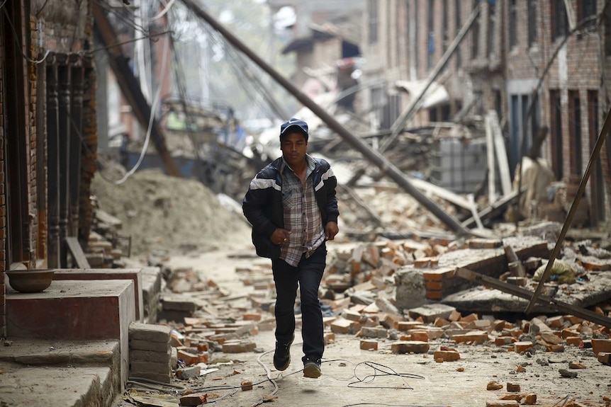 Man runs as aftershocks hit Nepal