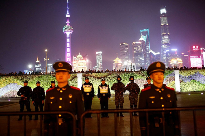 Police officers stand guard at the location where a stampede incident occurred during celebrations two years ago.