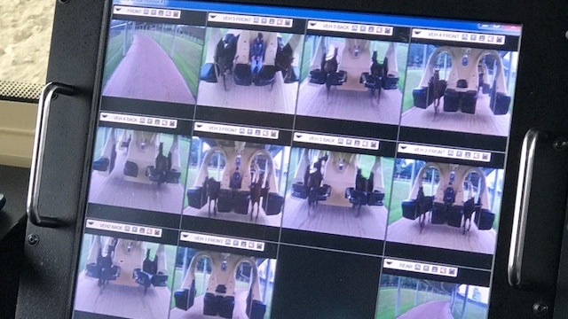A control dashboard shows footage of horses from various cameras.