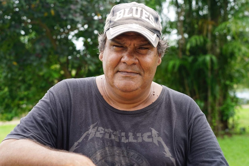 John Daly, an Indigenous man from Nauiyu community, stands and looks concerned.