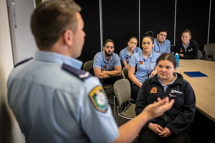 Nathan Towney guides iProwd participants at Redfern Police Station.