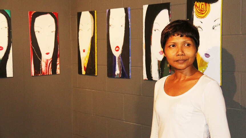 Indonesian artist Nyoman Sani, with her work 'The spirit of Uluru'.