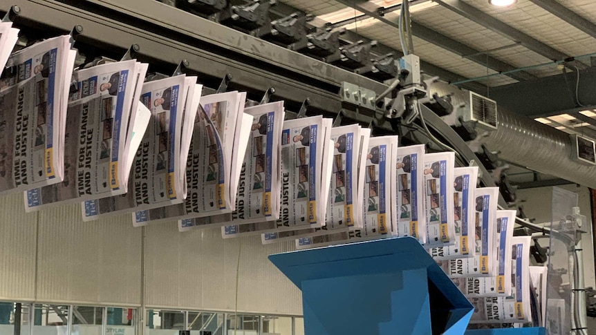 Hanging newspapers in printing press