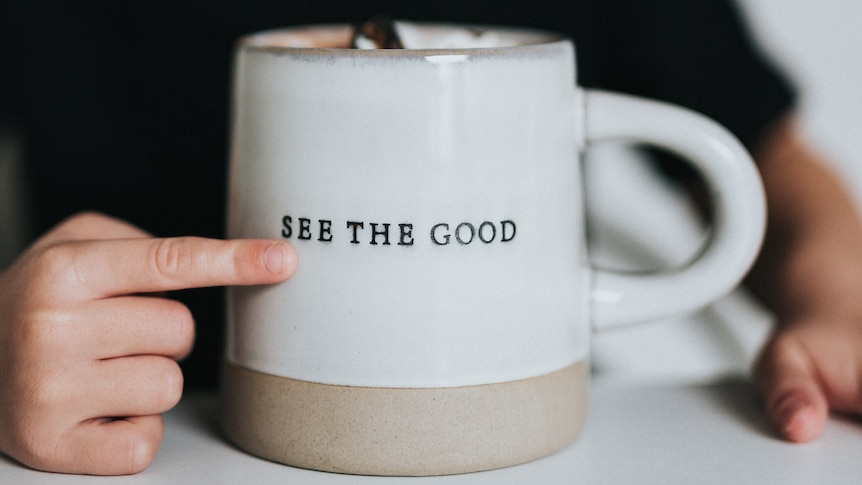A mug that says "see the good"