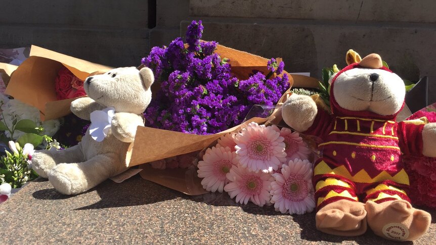 Flowers laid on Bourke St