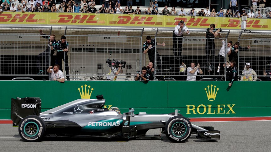 Mercedes crew celebrates as Lewis Hamilton wins US Grand Prix