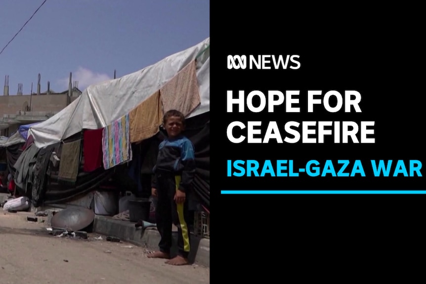 Hope For Ceasefire, Gaza-Israel War: Barefoot boy stands in on dusty gutter next to makeshift tent housing.