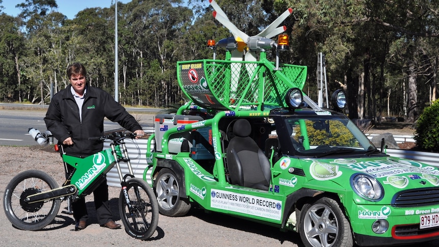 Birdsville or bust: Allan Lear with his electric bicycle and modified Moke