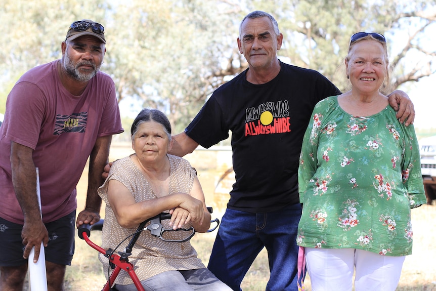 A group of four people by the Warrego River in Cunnamulla