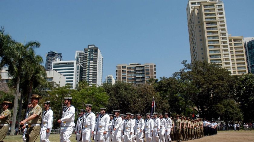 The honour guard at the Q150 Proclamation Day celebrations leave the Botanical Gardens in Brisbane.