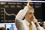 Stock trader Dirk Mueller gestures