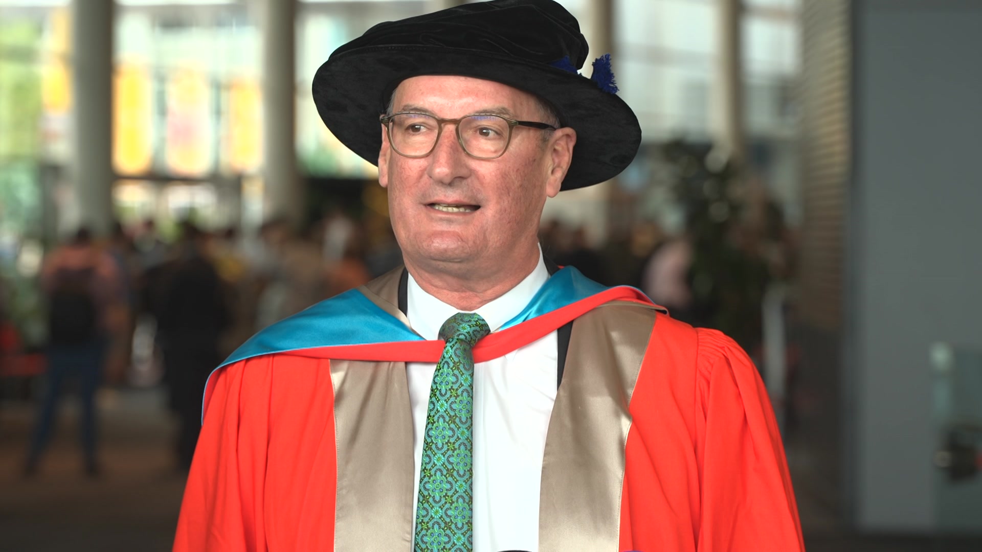 David Koch in university regalia.