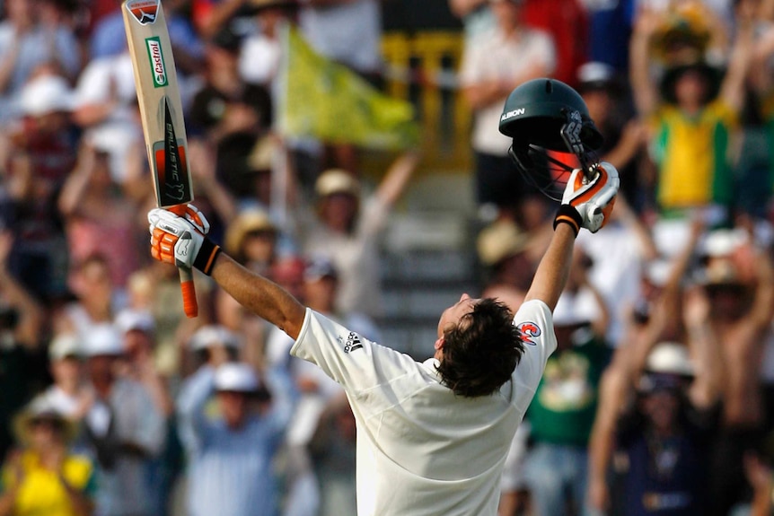 Australia's Adam Gilchrist celebrates after reaching a century against England at the WACA in 2006.