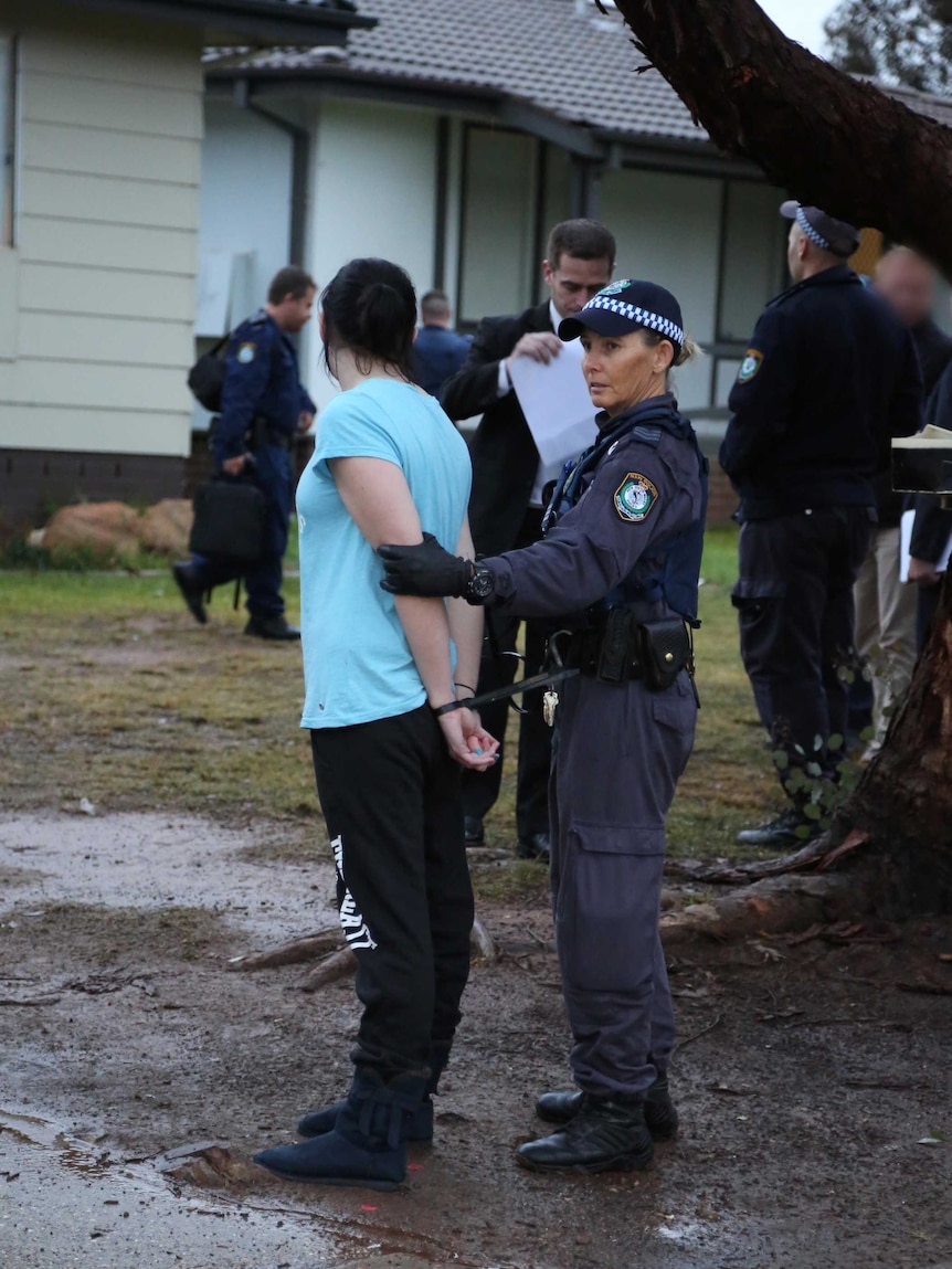 A woman arrested in Raye Street in the Wagga Wagga suburb of Tolland as part of the NSW Police Force's Strike Force Calyx.