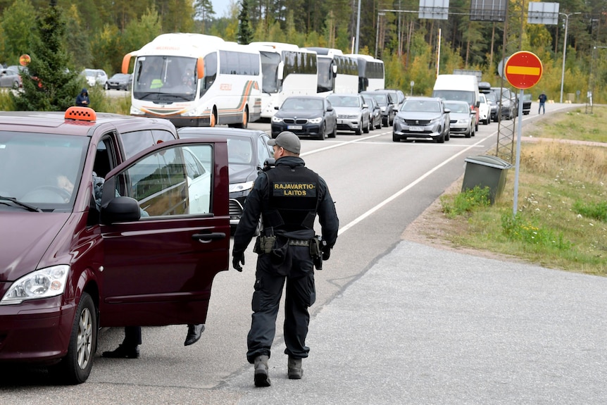 Finnish border guards check a Russian vehicle at the Vaalimaa border check point in Virolahti, Finland.