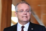 Scott Morrison pulls a face while speaking to reporters