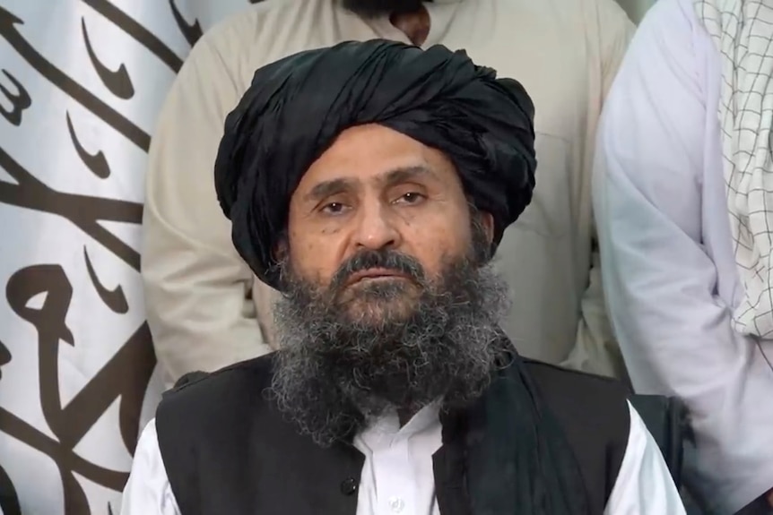 An image of Mullah Baradar Akhund making a video statement