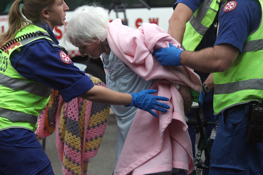 Elderly residents evacuated to a triage set up at the local church