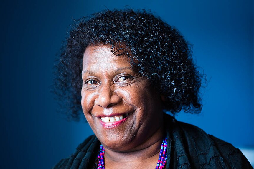 A professional portraiat of Gail Mabo smiling