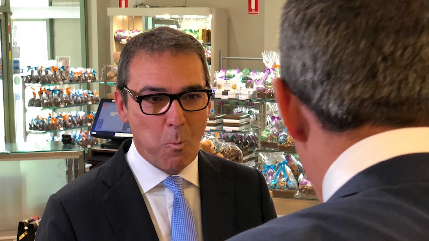 Opposition Leader Steven Marshall eating chocolate while visiting Haighs Chocolates in Adelaide