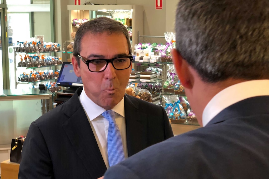 Opposition Leader Steven Marshall eating chocolate while visiting Haighs Chocolates in Adelaide