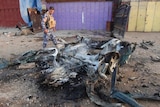 Iraqi policeman at site of car bomb attack in Kirkuk